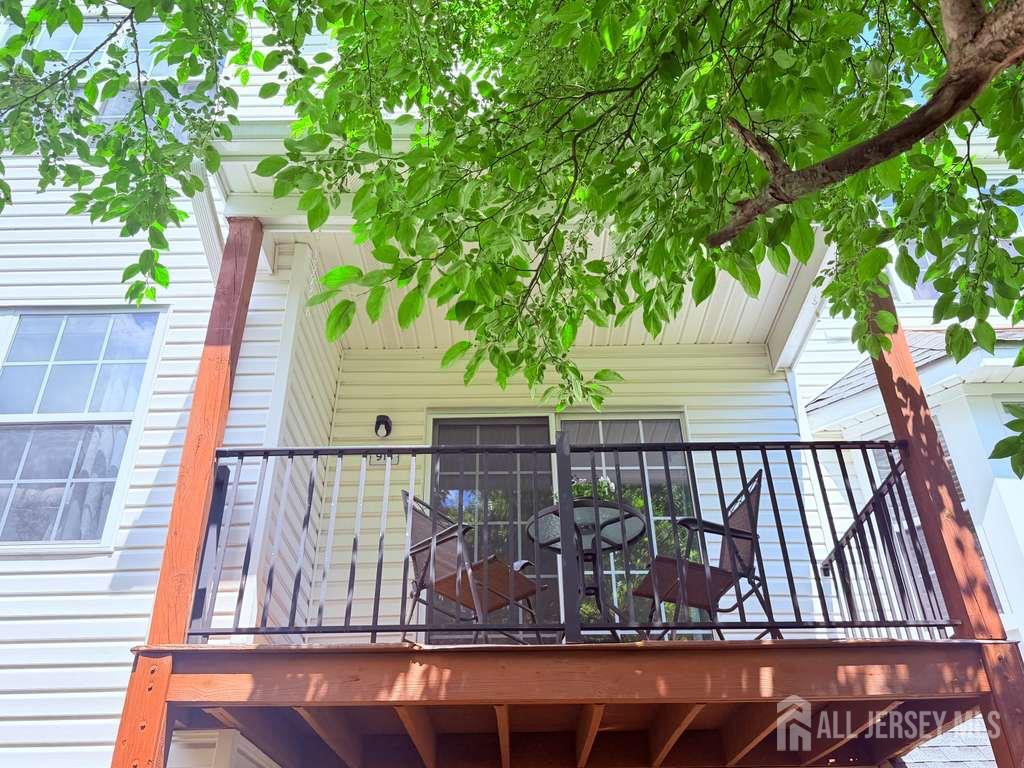 918 Plymouth Road North Brunswick, NJ 08902 - Photo 30 of 30 a view of deck with large trees and wooden fence