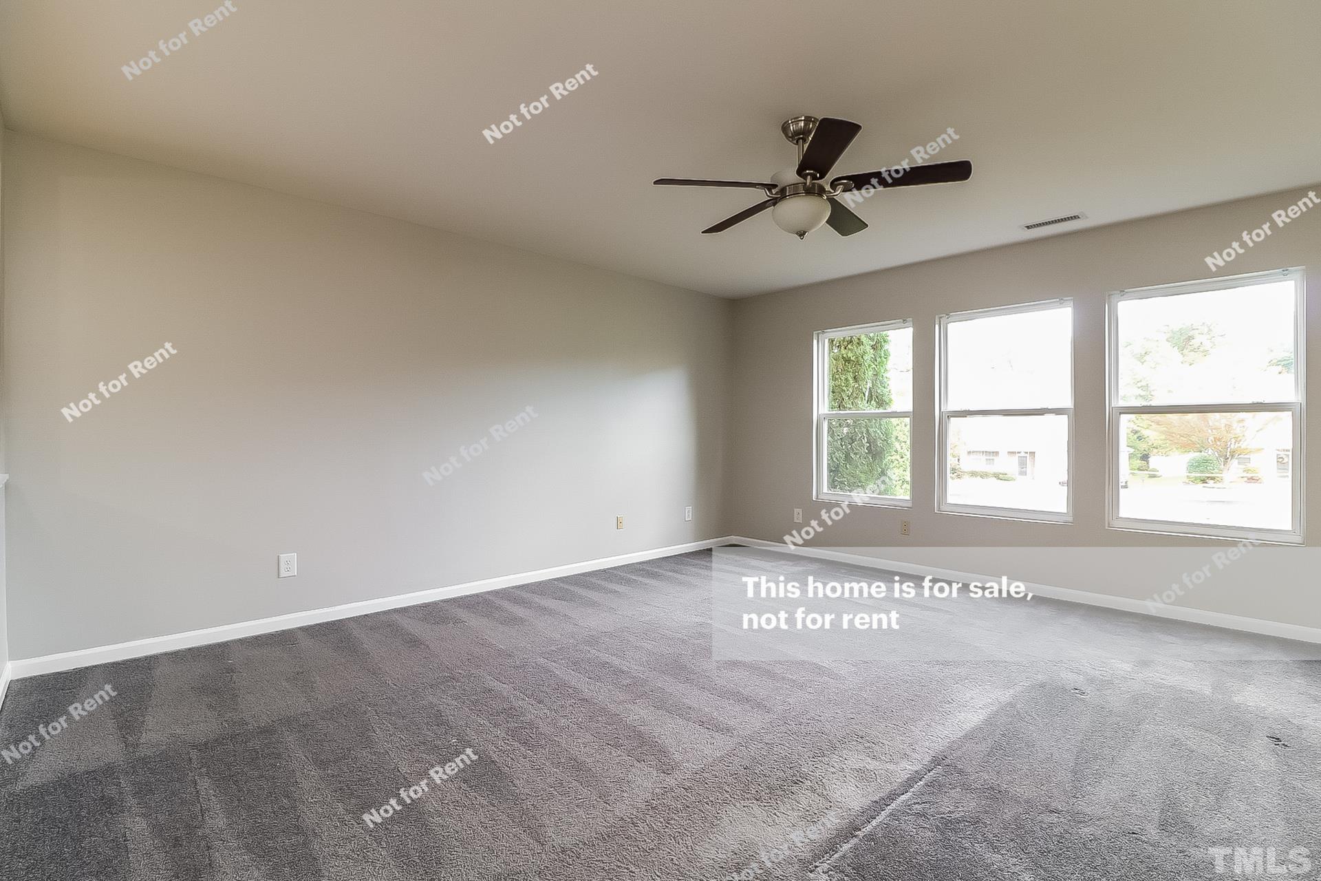 115 Cinder Cross Way Garner, NC 27529 - Photo 16 of 27 a view of an empty room with a window