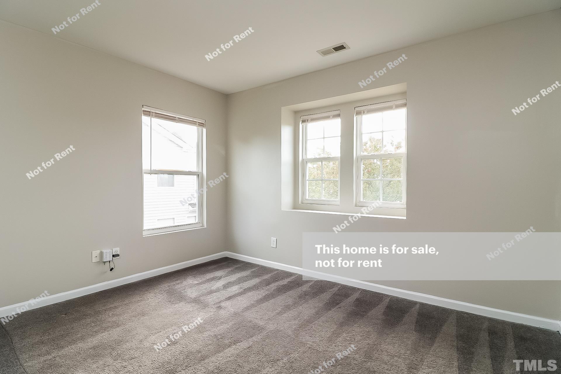 115 Cinder Cross Way Garner, NC 27529 - Photo 18 of 27 a view of an empty room and a window