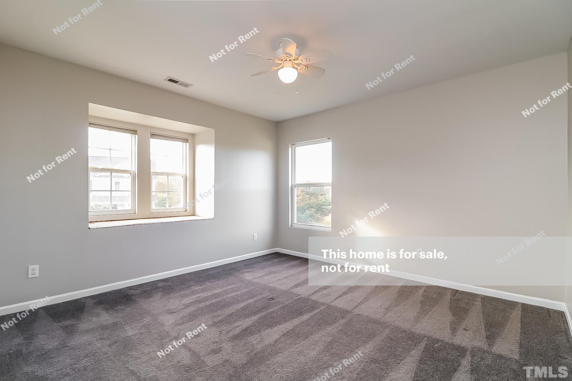 115 Cinder Cross Way Garner, NC 27529 - Photo 19 of 27 an empty room with windows and entrance