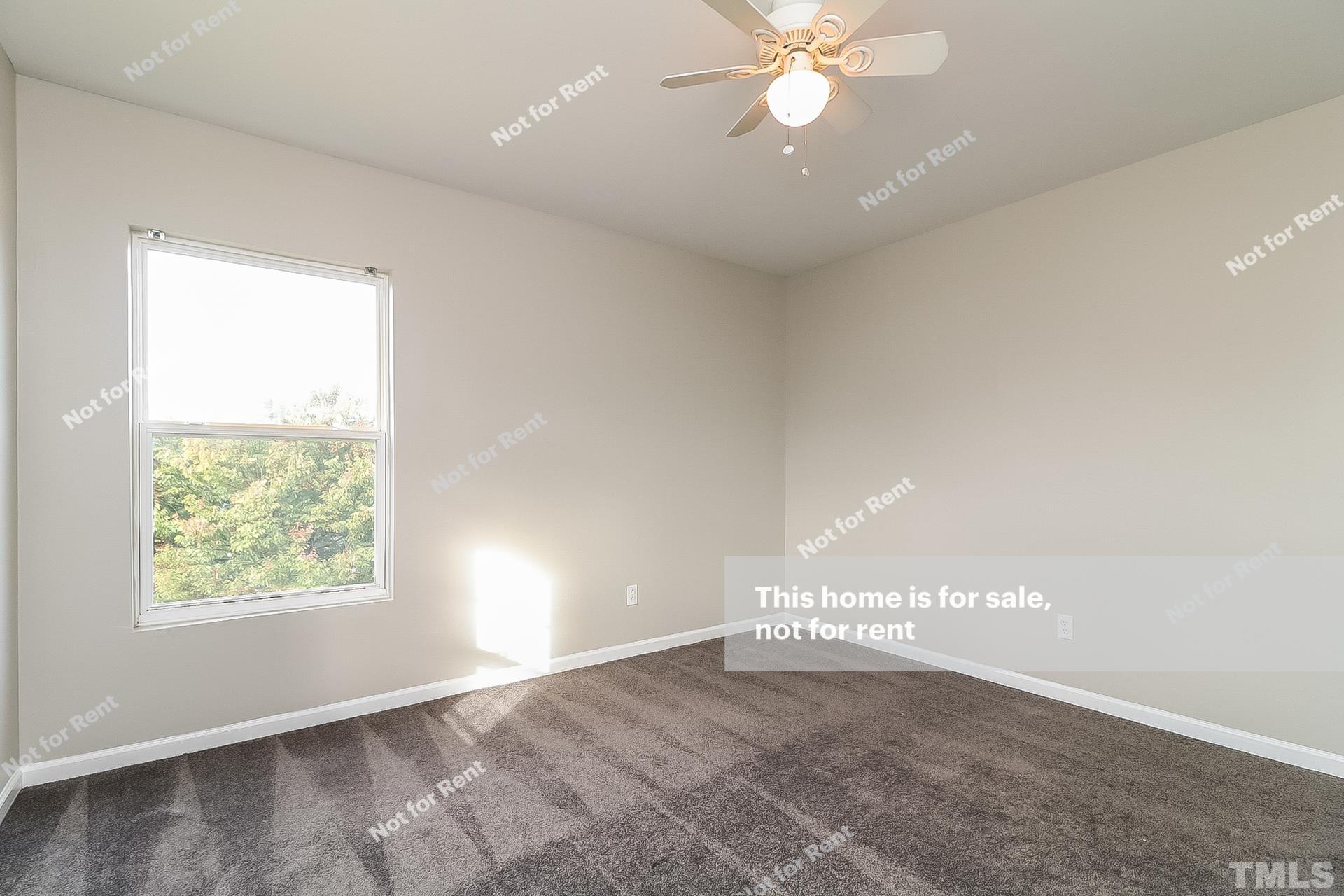 115 Cinder Cross Way Garner, NC 27529 - Photo 20 of 27 an empty room with windows and ceiling fan