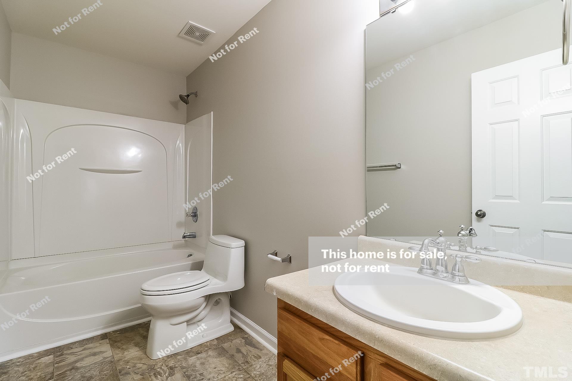 115 Cinder Cross Way Garner, NC 27529 - Photo 25 of 27 a bathroom with a sink toilet and shower