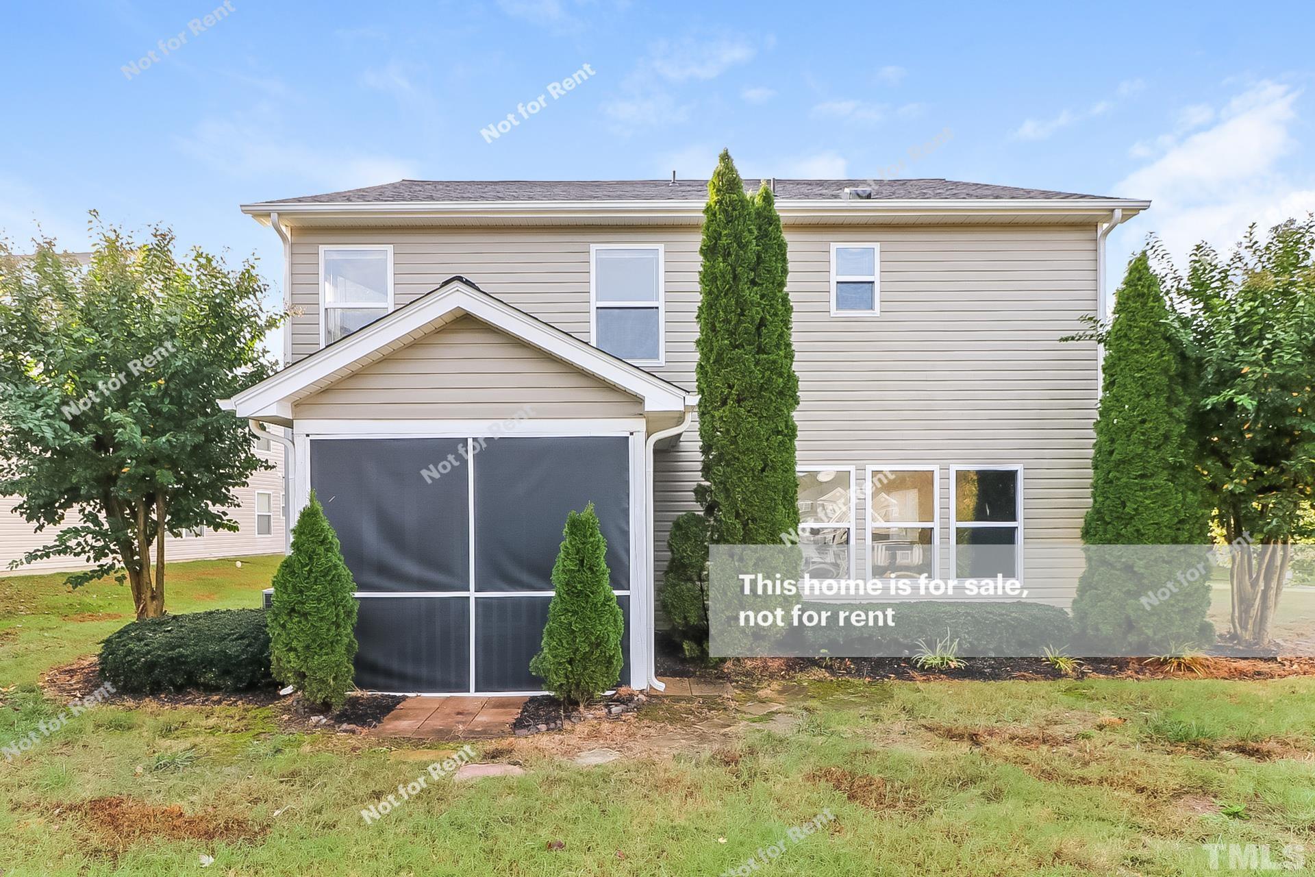 115 Cinder Cross Way Garner, NC 27529 - Photo 26 of 27 a view of a house with a small yard and potted plants
