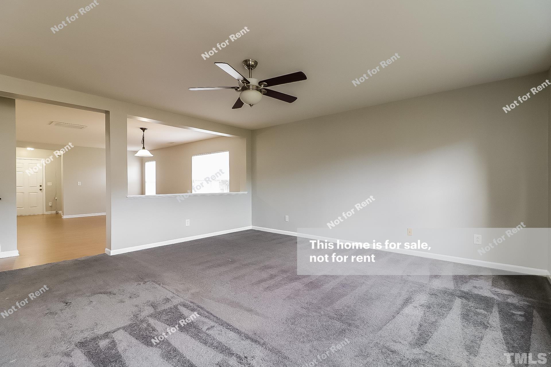 115 Cinder Cross Way Garner, NC 27529 - Photo 4 of 27 a view of an empty room and window