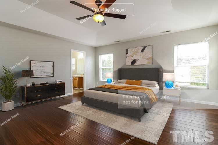 115 Cinder Cross Way Garner, NC 27529 - Photo 9 of 27 a living room with a bed furniture and a window