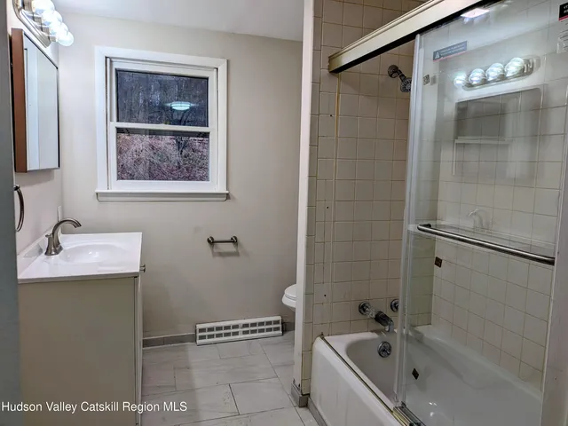 a bathroom with a bathtub and a sink