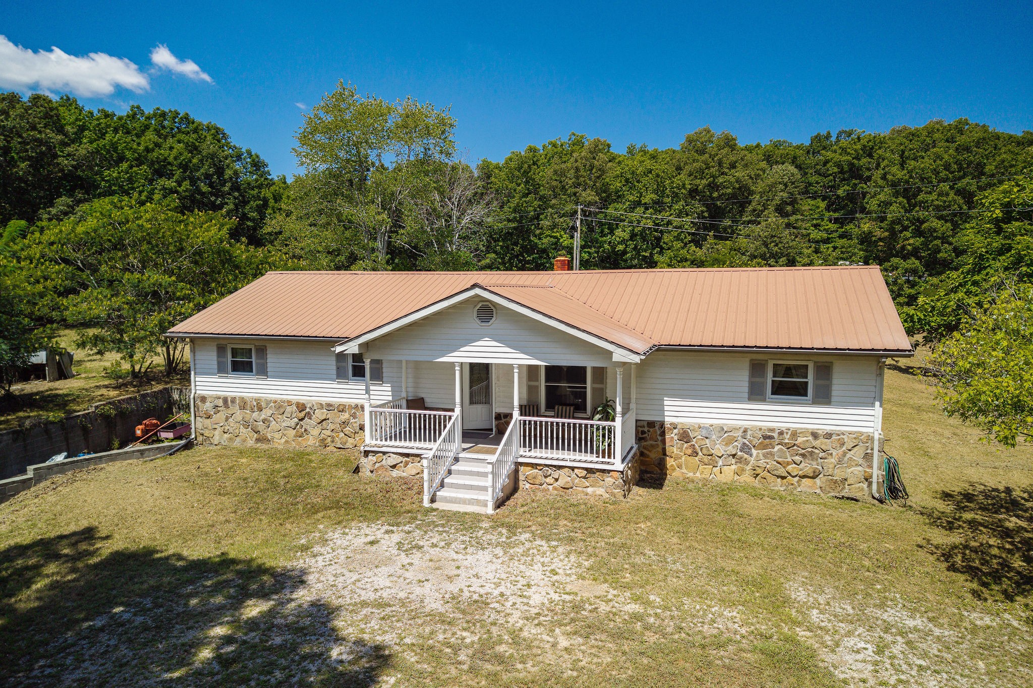 a front view of a house with a yard tree s