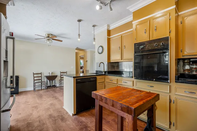 a kitchen with a table and chairs in it
