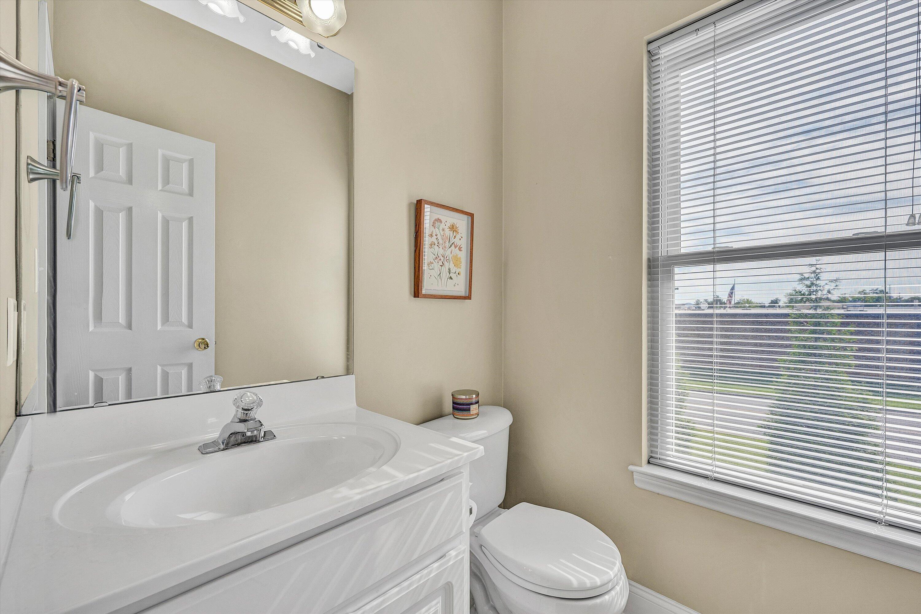1913 South Clearing Road Salem, VA 24153 - Photo 17 of 28 a bathroom with a sink a toilet and a window