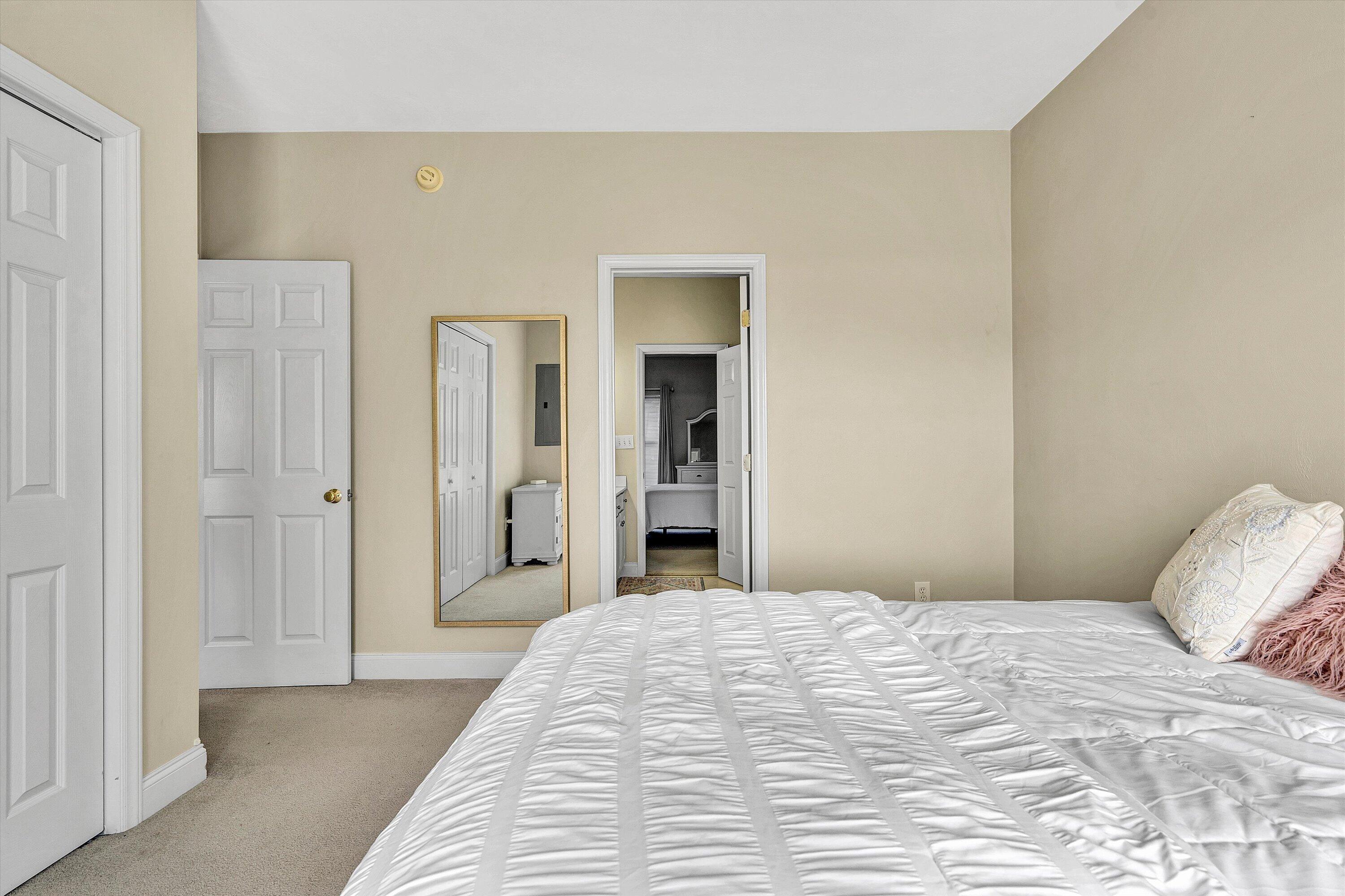 1913 South Clearing Road Salem, VA 24153 - Photo 19 of 28 a bedroom with a bed and a mirror