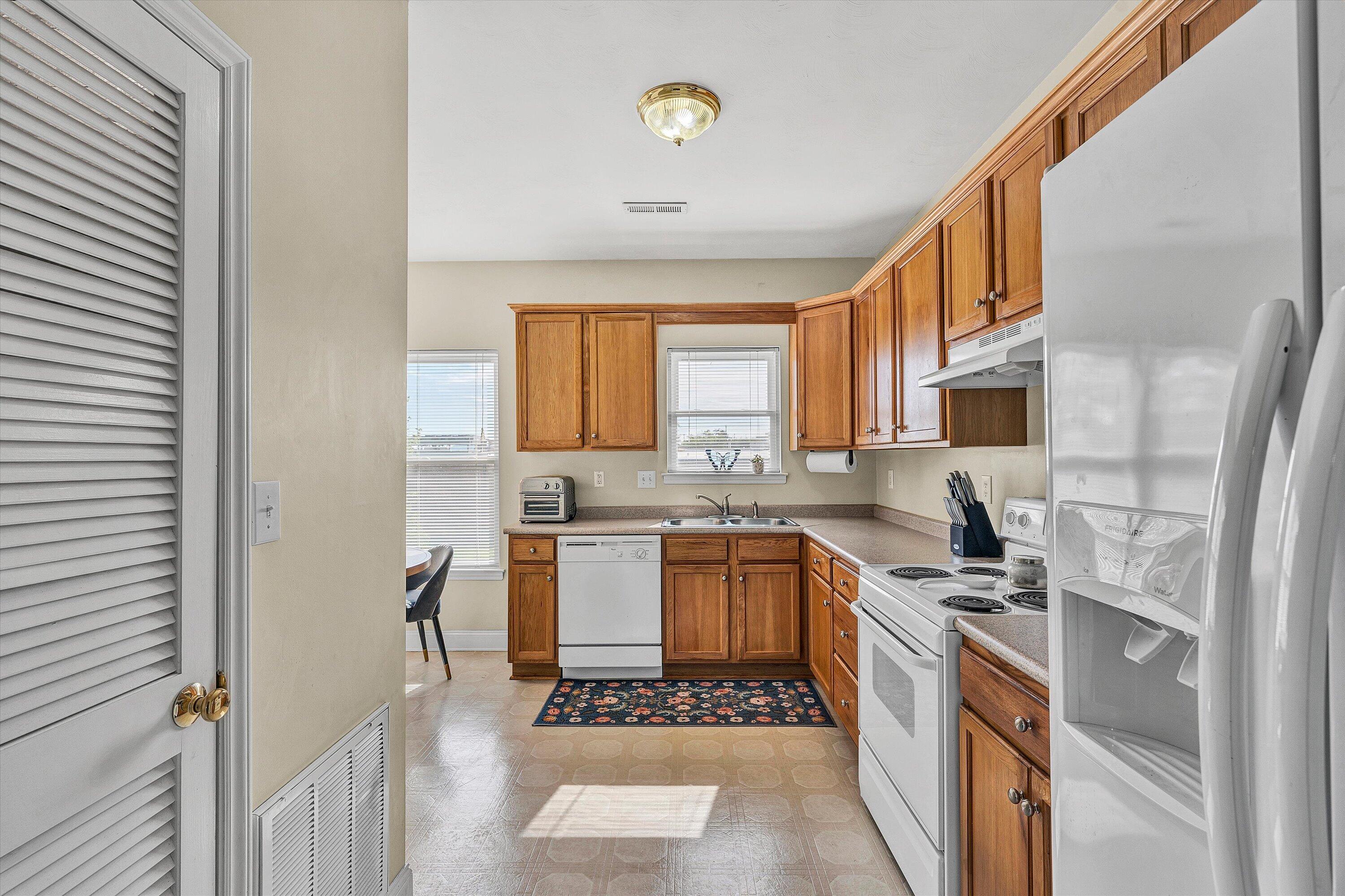 1913 South Clearing Road Salem, VA 24153 - Photo 8 of 28 a kitchen with stainless steel appliances granite countertop a stove a sink and a refrigerator