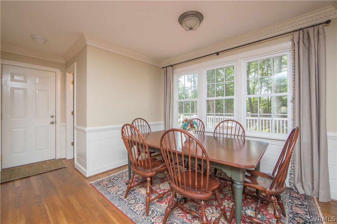 14211 Helmsley Road Midlothian, VA 23113 - Photo 22 of 47 a view of a dining room with furniture window and outside view