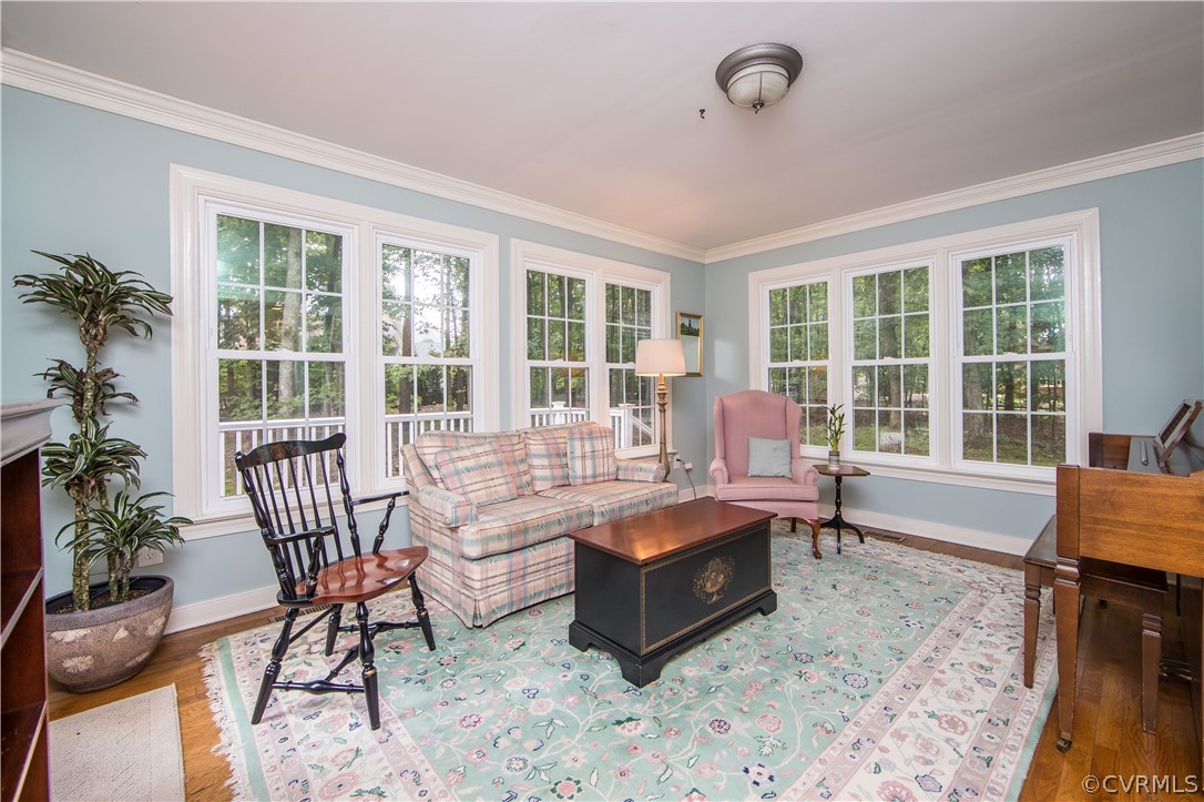 14211 Helmsley Road Midlothian, VA 23113 - Photo 23 of 47 a living room with furniture and floor to ceiling windows