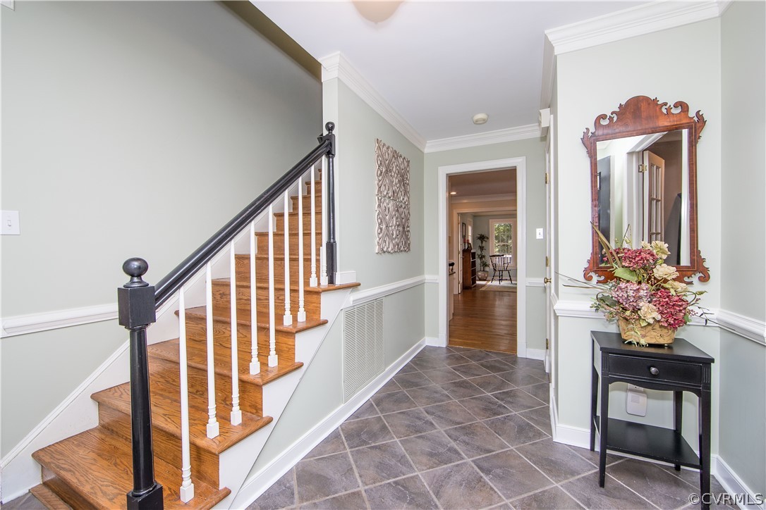 14211 Helmsley Road Midlothian, VA 23113 - Photo 7 of 47 a view of entryway with a flower pot and a living room