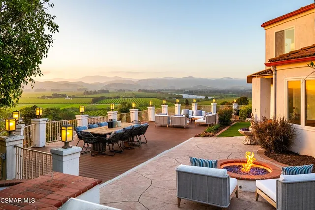a view of a swimming pool with an outdoor seating