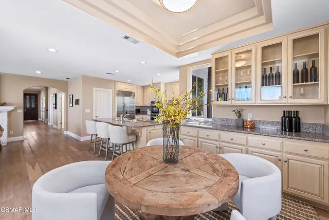 a dining room with furniture and window