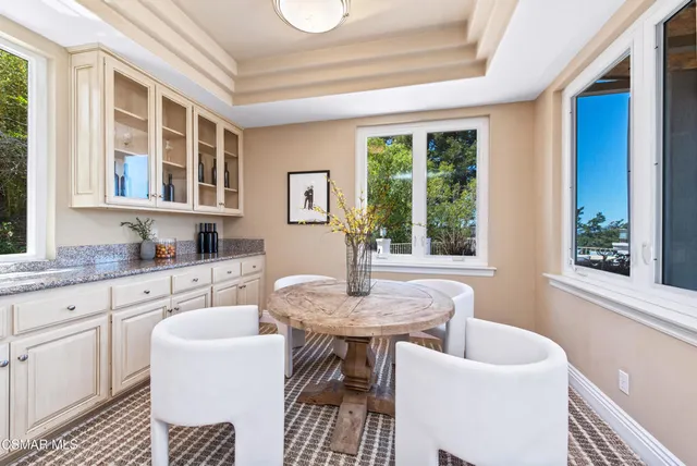 a kitchen with counter top space and wooden floor