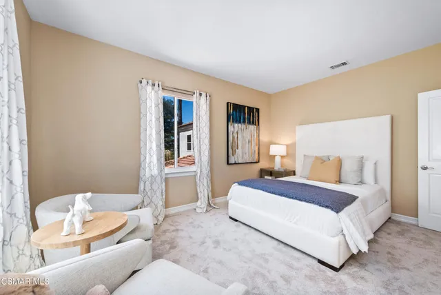 a bathroom with double sink and a mirror