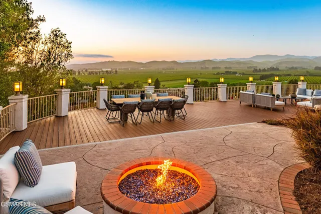 a view of a chairs and table on the deck