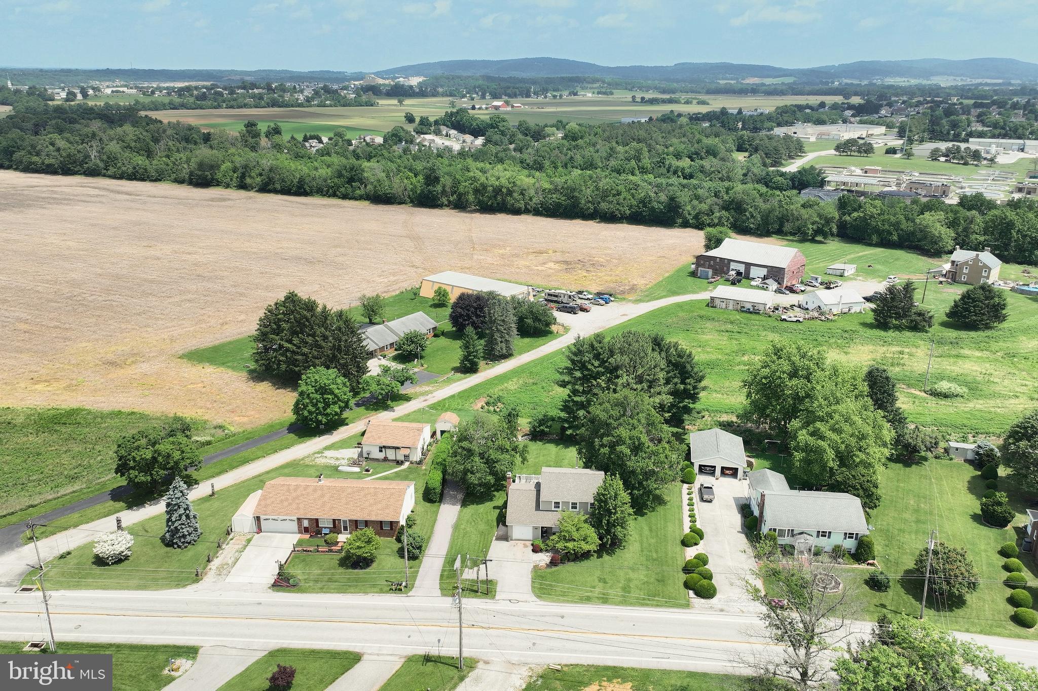 3604 Centennial Road Hanover, PA 17331 - Photo 44 of 48 an aerial view of green landscape with trees houses and lake view