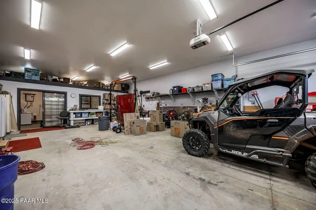 a kitchen with a stove a sink and a wooden floors