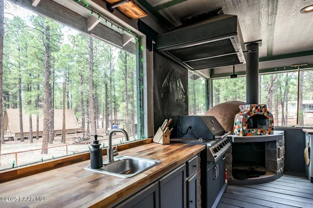 a view of a house with a yard and tree s