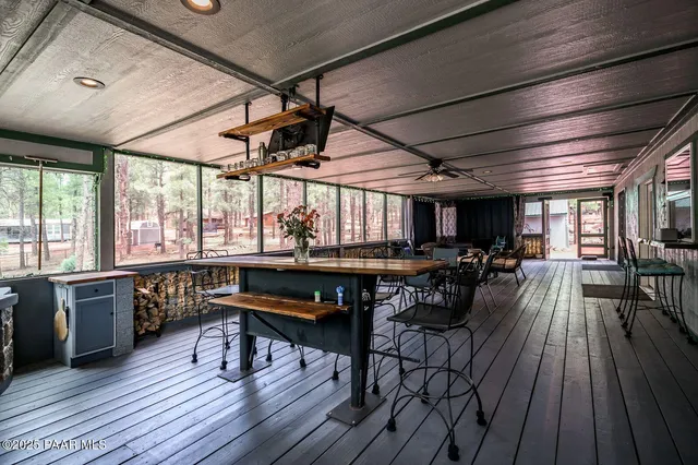 a view of a house with a yard and wooden fence
