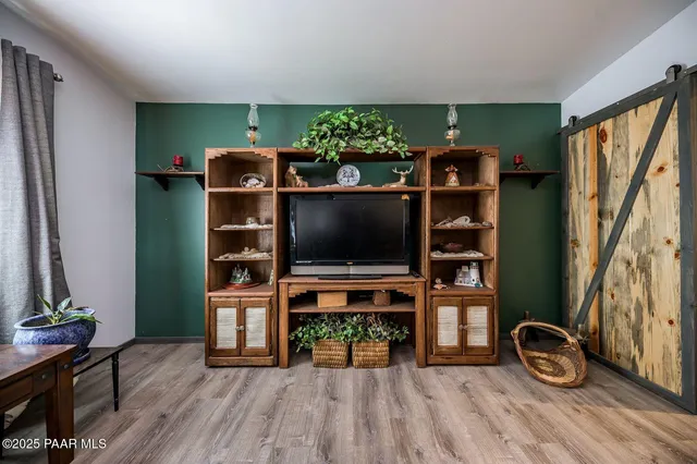 a room with furniture and a flat screen tv