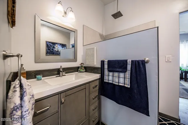 a bathroom with a sink and a mirror