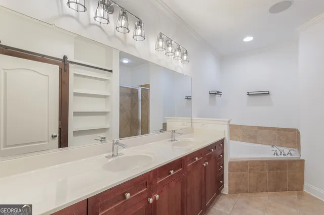 a bathroom with a double vanity sink and a mirror