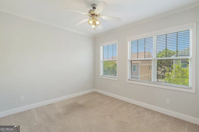 a view of a bathroom with a toilet sink and a mirror