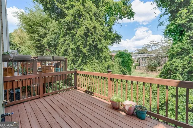 a view of balcony with wooden floor