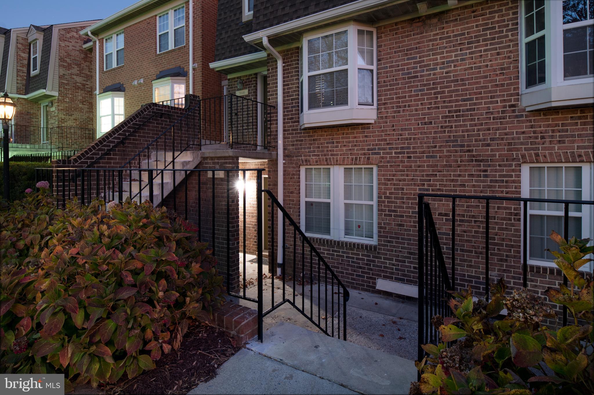 a view of a house with iron fence