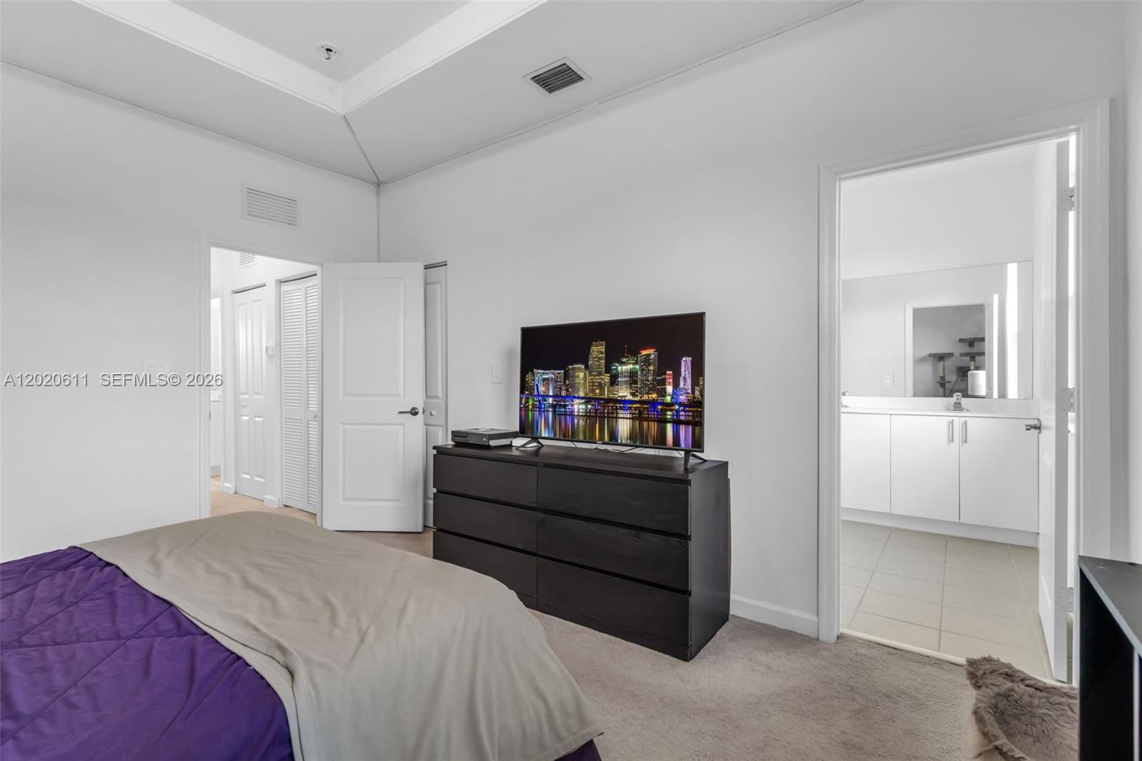 26455 Southwest 148th Avenue Homestead, FL 33032 - Photo 16 of 35 a bed room with a bed and a television