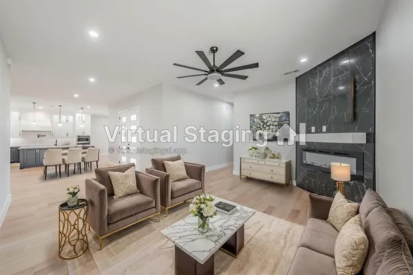 a living room with furniture and a large window