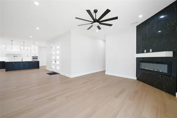 a view of a kitchen with a sink and a stove