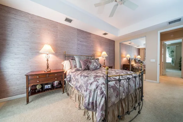 a bed room with a bed and a lamp