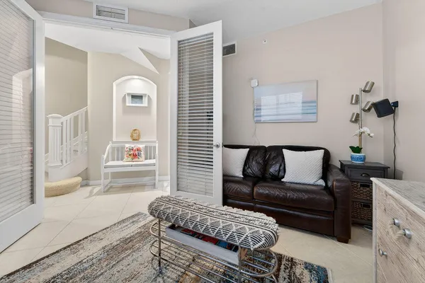 a living room with furniture and wooden floor