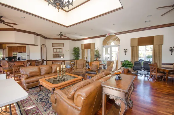 a living room with lots of furniture and a large window