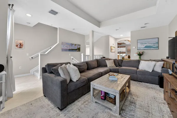 a living room with furniture and a rug