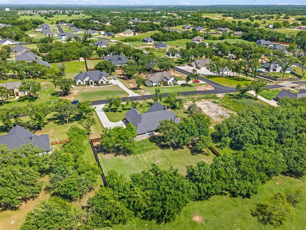 200 Clayton Crossing Springtown, TX 76082 - Photo 38 of 40 an aerial view of residential houses with outdoor space and trees