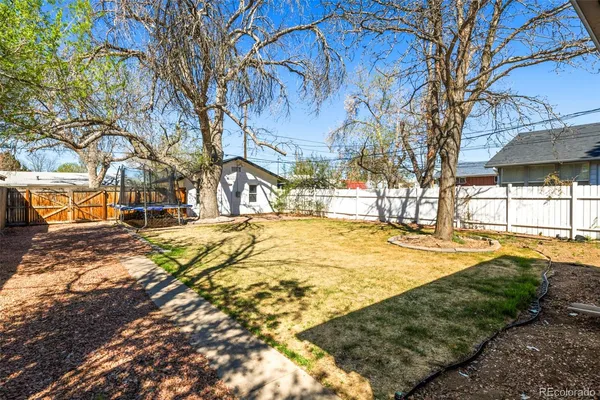a view of yard with swimming pool