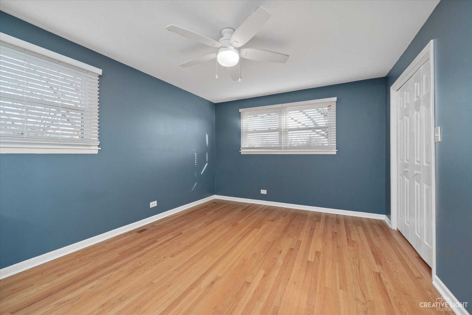 1925 Briarcliffe Boulevard Wheaton, IL 60189 - Photo 8 of 21 wooden floor in an empty room with a window
