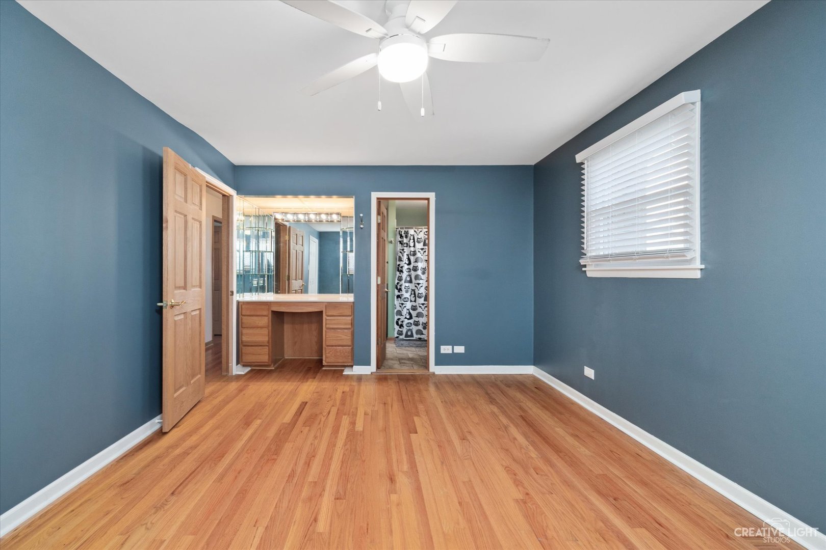 1925 Briarcliffe Boulevard Wheaton, IL 60189 - Photo 9 of 21 wooden floor in an empty room with a window