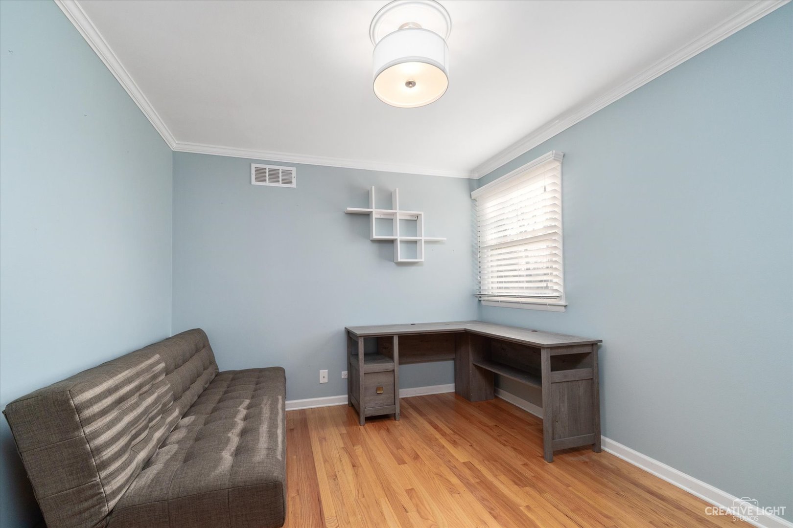 1925 Briarcliffe Boulevard Wheaton, IL 60189 - Photo 10 of 21 a view of room with wooden floor and window
