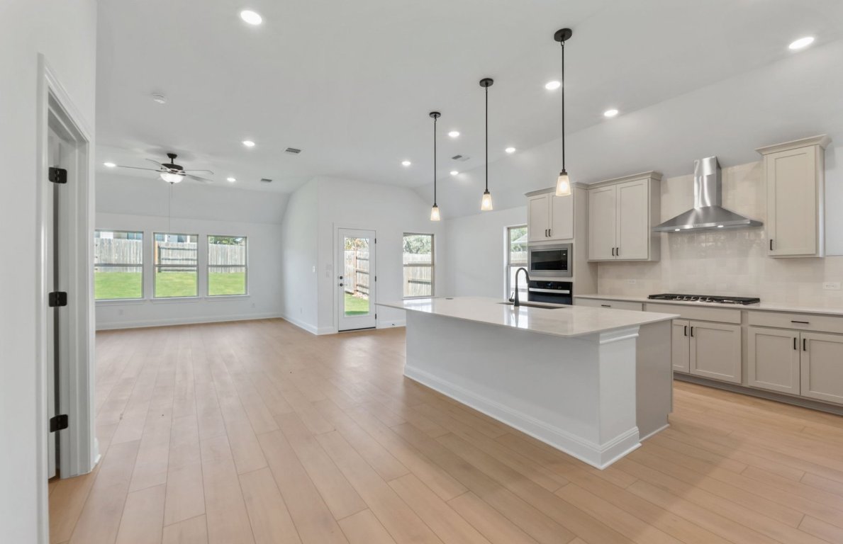 800 Crescent View Drive Georgetown, TX 78628 - Photo 19 of 36 a large kitchen with stainless steel appliances kitchen island a large island in the center
