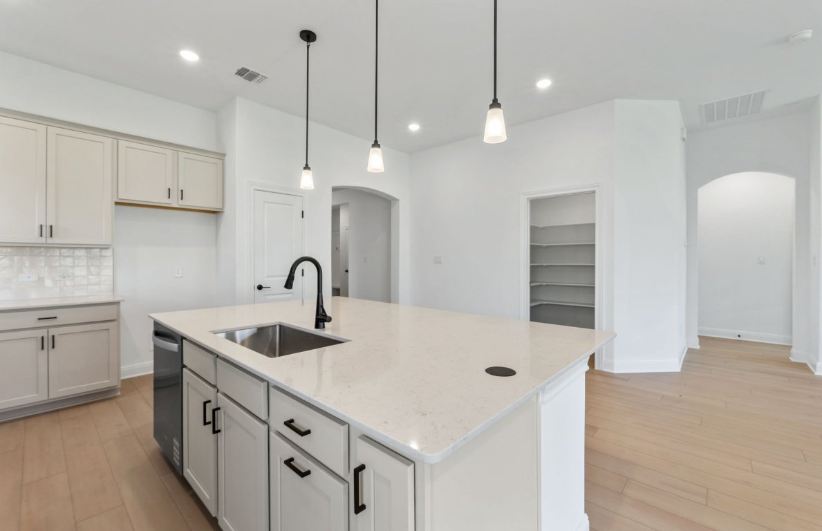 800 Crescent View Drive Georgetown, TX 78628 - Photo 22 of 36 a kitchen that has a lot of white cabinets and stainless steel appliances