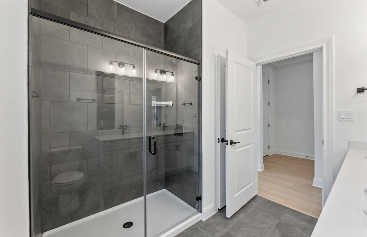 800 Crescent View Drive Georgetown, TX 78628 - Photo 6 of 36 a bathroom with a shower and a sink