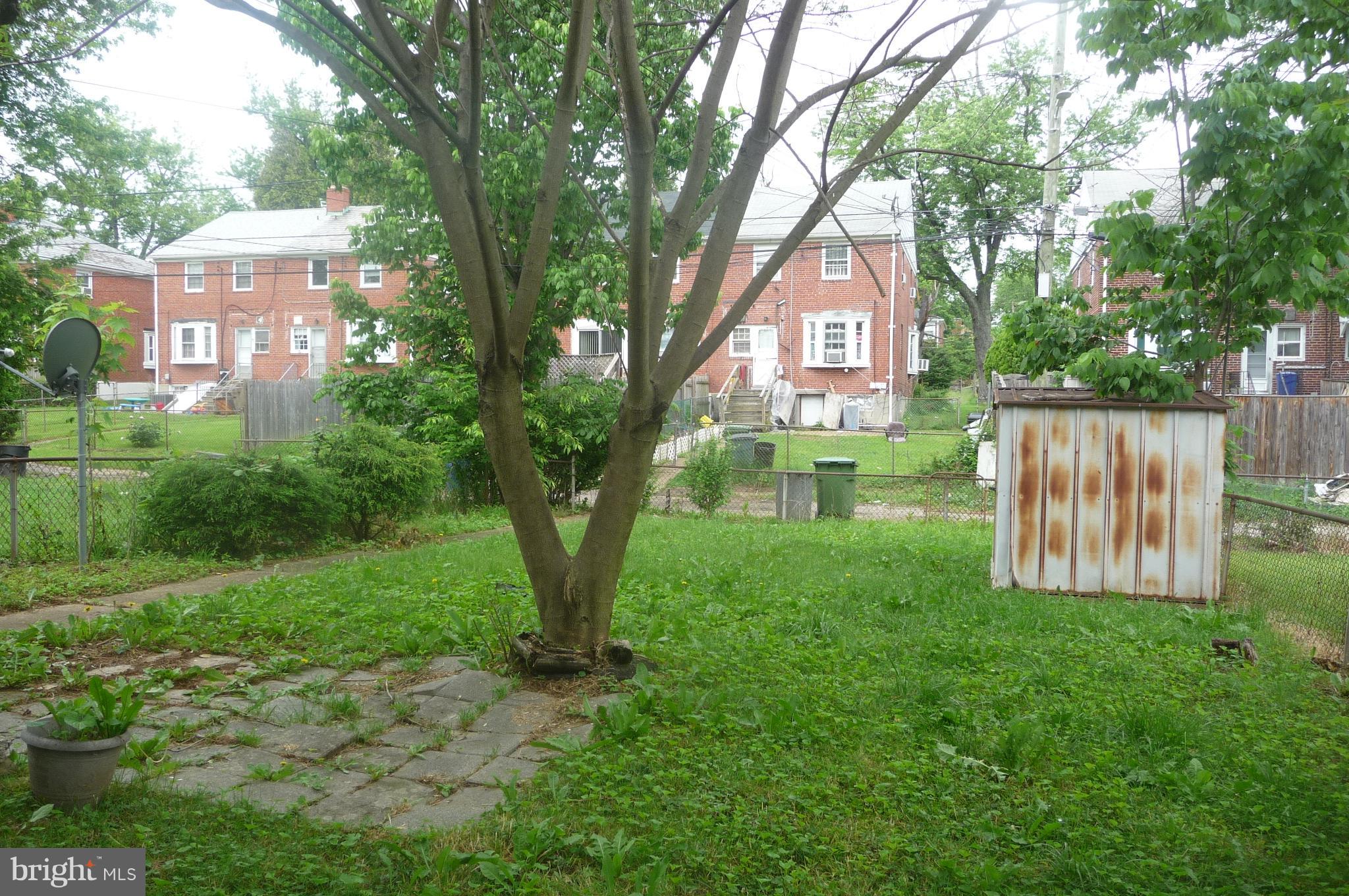 3924 Clarinth Road Baltimore, MD 21215 - Photo 3 of 15 a view of a front of a house with a yard