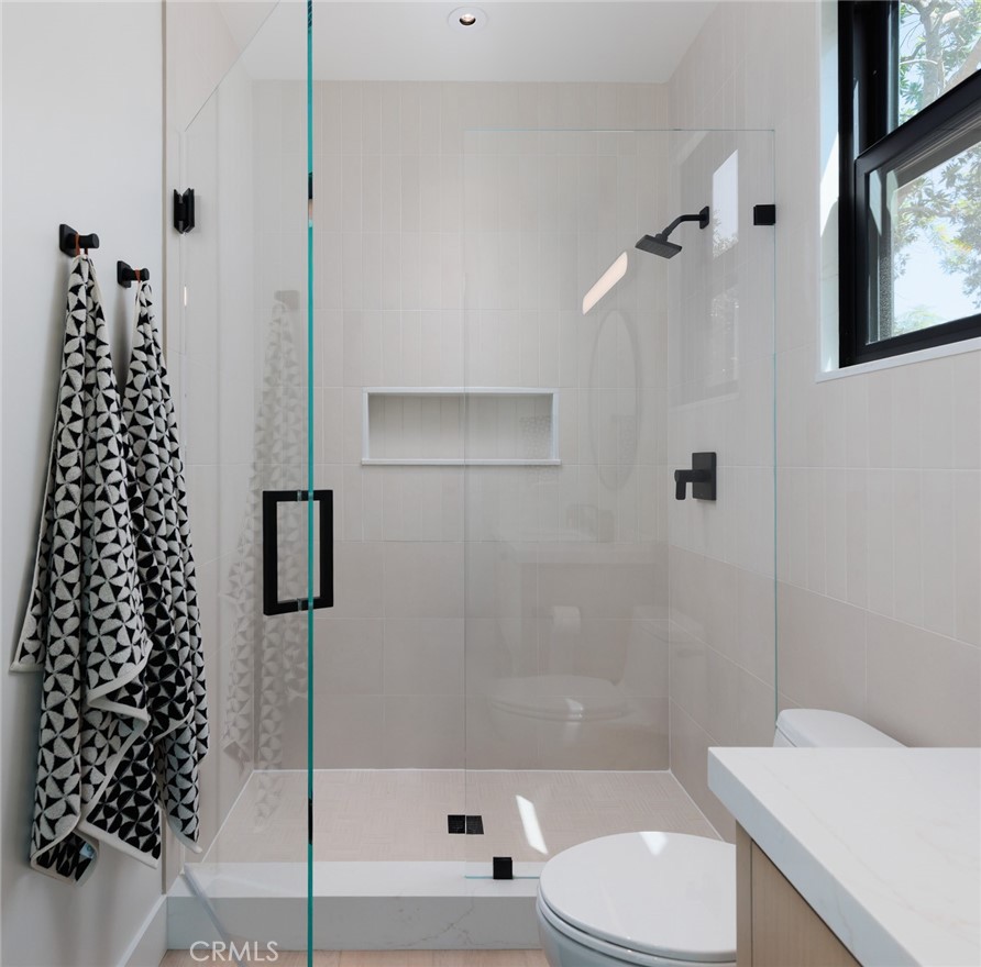 a bathroom with a toilet a sink and bathtub